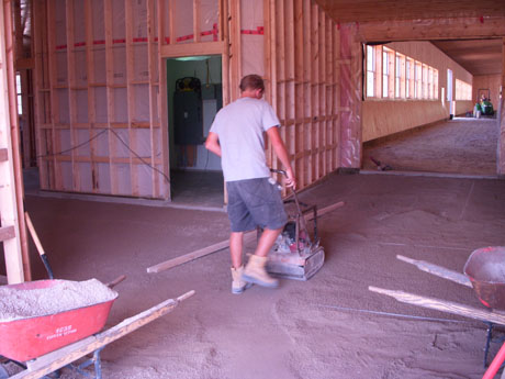 We lay section by section in the barns because we are not the only ones working in there, so we have to be courteous to the other trades. So we will prepare the base, then lay that section in and repeat.